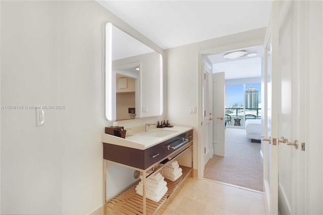 4401 Collins Ave Unit 2305, Miami Beach, FL 33140 - bathroom featuring vanity and baseboards