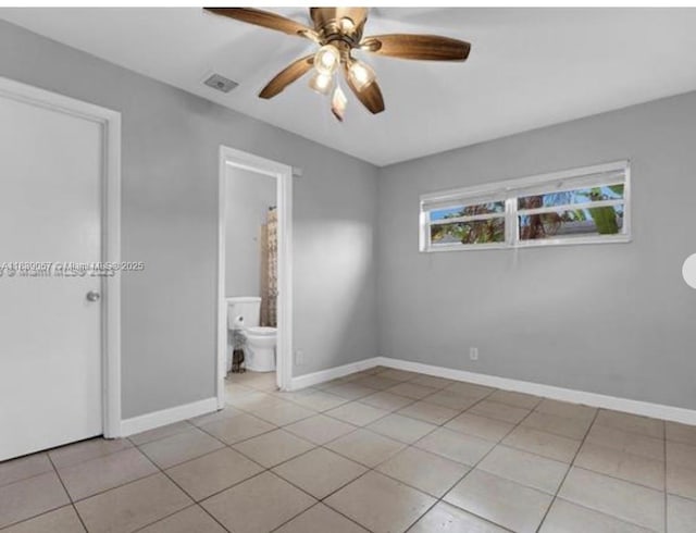 130 NE 21st Ct, Pompano Beach, FL 33060 - unfurnished bedroom with light tile patterned floors and ceiling fan