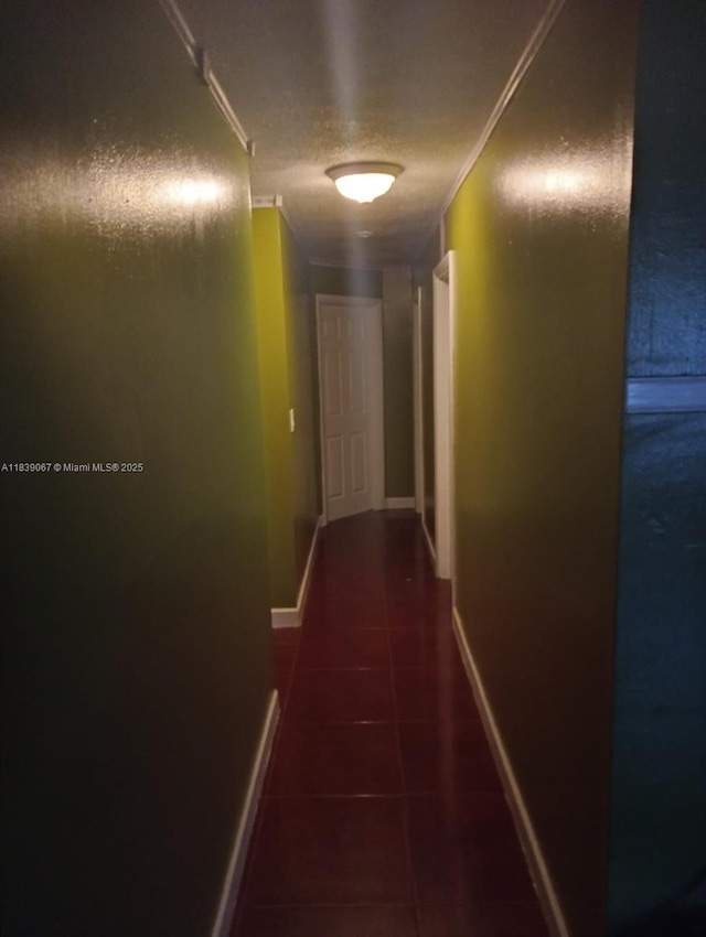 130 NE 21st Ct, Pompano Beach, FL 33060 - hallway featuring tile patterned flooring and baseboards