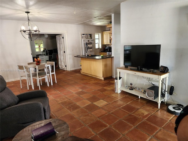 3521 E 8th Ave, Hialeah, FL 33013 - living room with a chandelier and dark tile patterned flooring