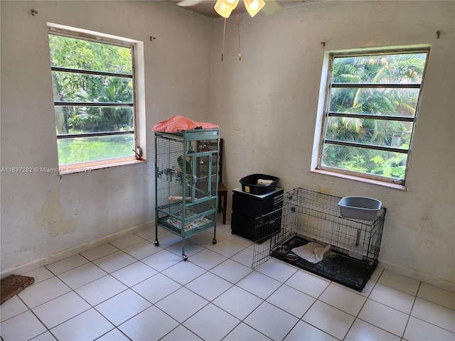 3521 E 8th Ave, Hialeah, FL 33013 - tiled empty room featuring healthy amount of natural light and ceiling fan