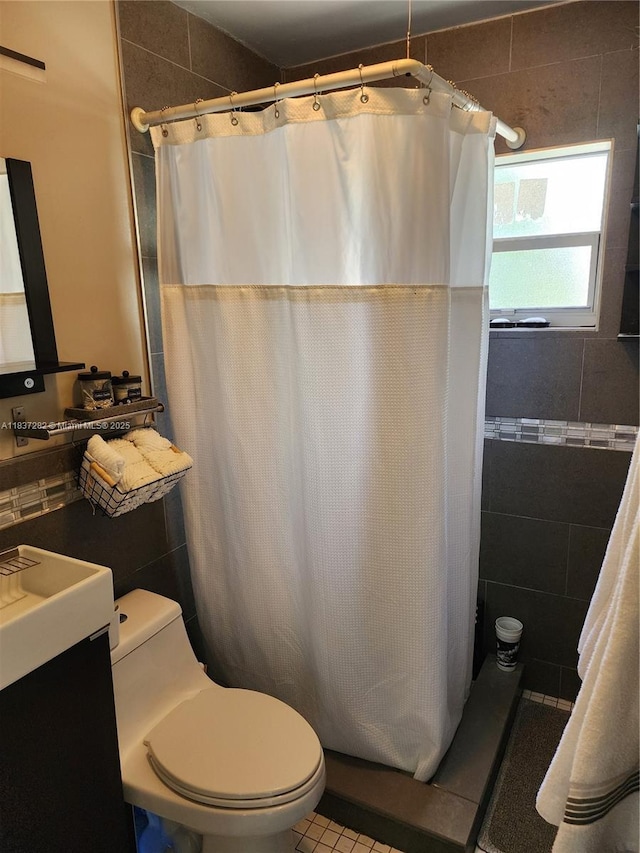 3521 E 8th Ave, Hialeah, FL 33013 - bathroom featuring tile walls, vanity, a shower with curtain, and tile patterned floors