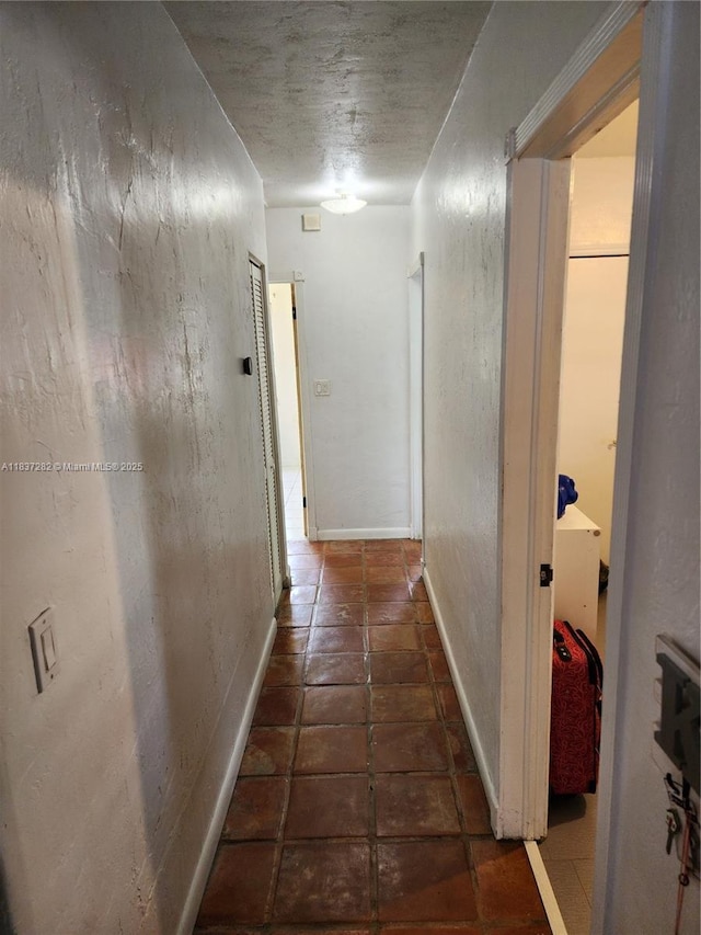3521 E 8th Ave, Hialeah, FL 33013 - hallway with tile patterned floors and baseboards