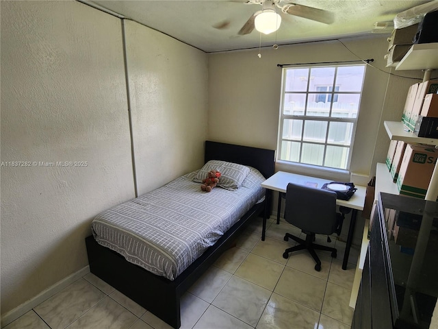 3521 E 8th Ave, Hialeah, FL 33013 - bedroom featuring light tile patterned floors, a ceiling fan, and a textured wall