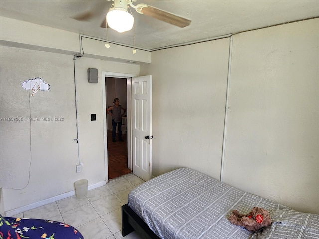 3521 E 8th Ave, Hialeah, FL 33013 - bedroom with light tile patterned flooring and ceiling fan