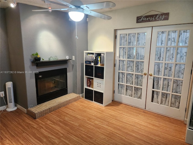 3521 E 8th Ave, Hialeah, FL 33013 - living area featuring wood finished floors, a brick fireplace, and a ceiling fan