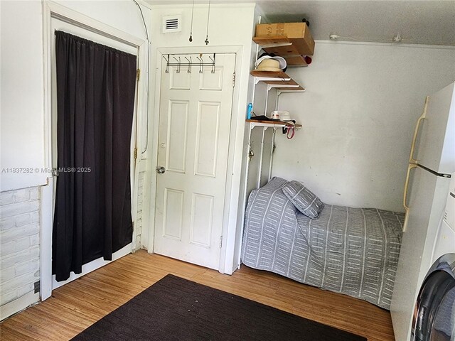 3521 E 8th Ave, Hialeah, FL 33013 - laundry area with wood finished floors