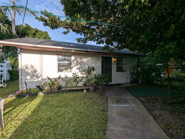 3521 E 8th Ave, Hialeah, FL 33013 - single story home with stucco siding and a front yard