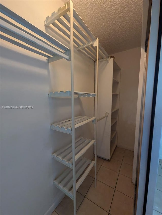 3521 E 8th Ave, Hialeah, FL 33013 - spacious closet featuring tile patterned flooring
