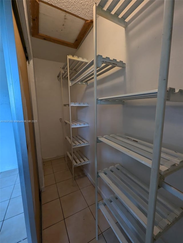3521 E 8th Ave, Hialeah, FL 33013 - spacious closet featuring tile patterned floors