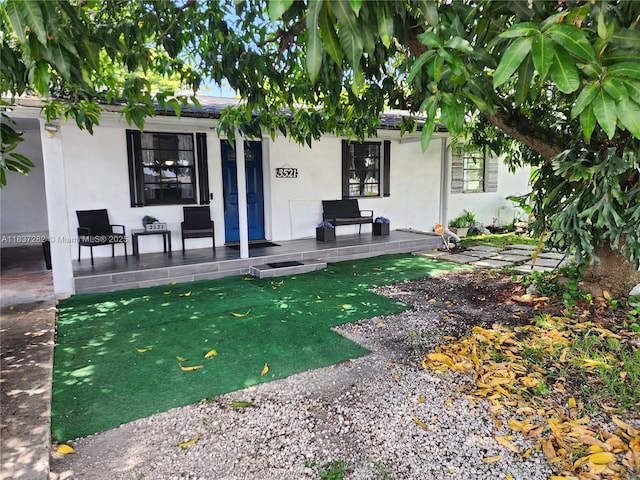 3521 E 8th Ave, Hialeah, FL 33013 - property entrance with stucco siding and a porch