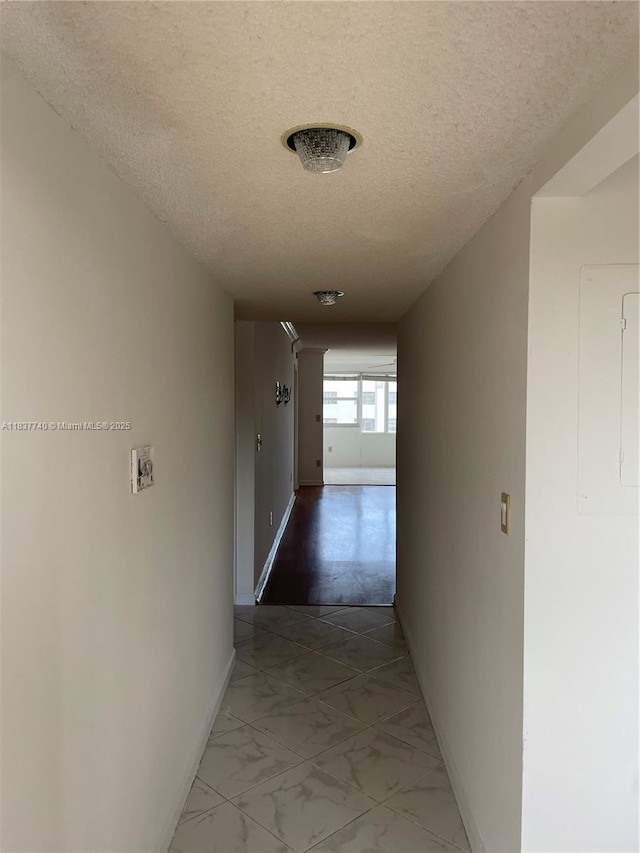 7152 S Devon Dr Unit 304, Tamarac, FL 33321 - corridor featuring a textured ceiling and light marble finish floors