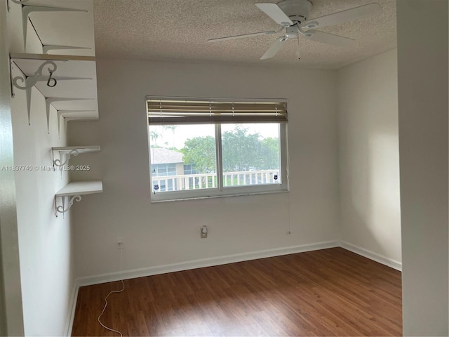 7152 S Devon Dr Unit 304, Tamarac, FL 33321 - unfurnished room featuring wood finished floors, ceiling fan, and a textured ceiling