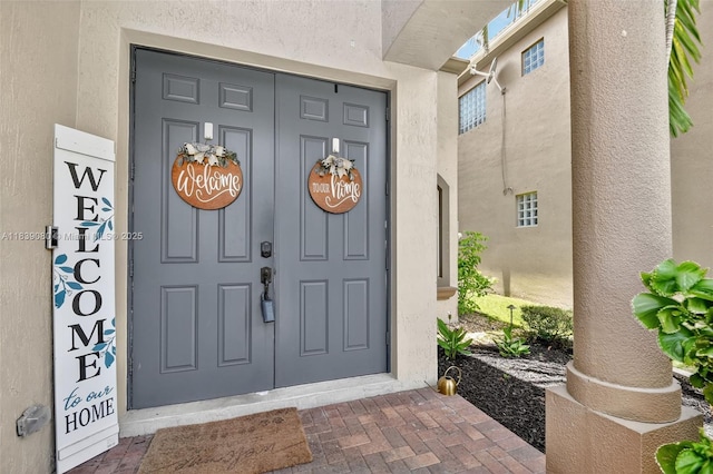 1086 Grove Park Cir, Boynton Beach, FL 33436 - entrance to property with stucco siding