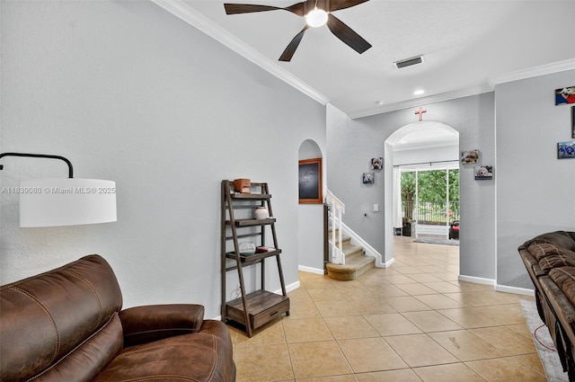 1086 Grove Park Cir, Boynton Beach, FL 33436 - living room featuring ornamental molding, arched walkways, a ceiling fan, stairs, and light tile patterned floors