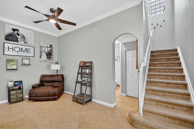 1086 Grove Park Cir, Boynton Beach, FL 33436 - sitting room with arched walkways, ceiling fan, light tile patterned flooring, crown molding, and stairway