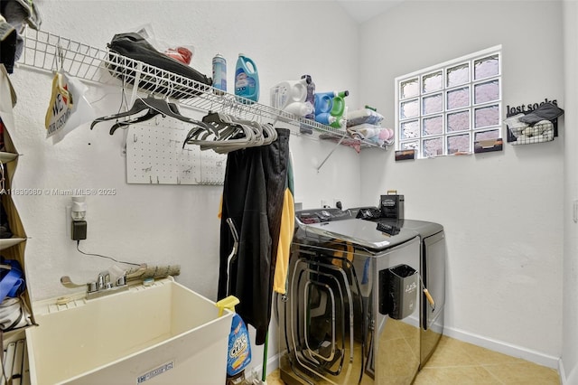 1086 Grove Park Cir, Boynton Beach, FL 33436 - laundry area with washer and clothes dryer and tile patterned flooring