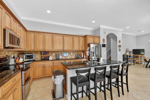1086 Grove Park Cir, Boynton Beach, FL 33436 - kitchen featuring stainless steel appliances, light tile patterned floors, decorative backsplash, recessed lighting, and crown molding
