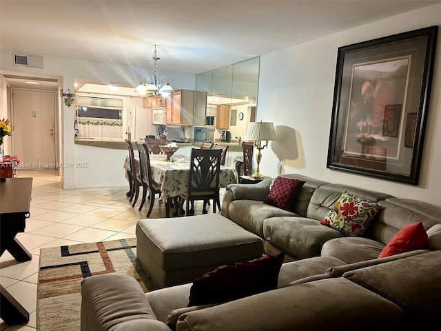 1206 Bahama Bnd Unit F2, Coconut Creek, FL 33066 - living area featuring light tile patterned floors and a chandelier