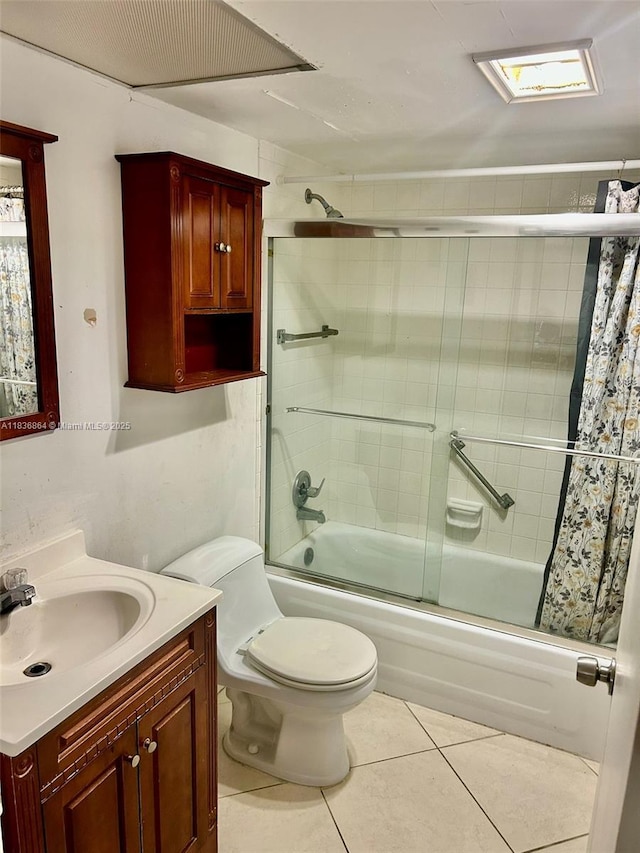 1206 Bahama Bnd Unit F2, Coconut Creek, FL 33066 - bathroom featuring vanity, combined bath / shower with glass door, and tile patterned floors
