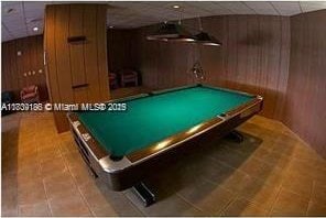 2750 NE 183rd St Unit 1701, Aventura, FL 33160 - game room with wood walls, tile patterned floors, and pool table