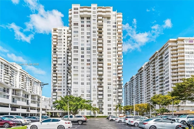 2750 NE 183rd St Unit 1701, Aventura, FL 33160 - view of apartment building / complex featuring uncovered parking and a city view