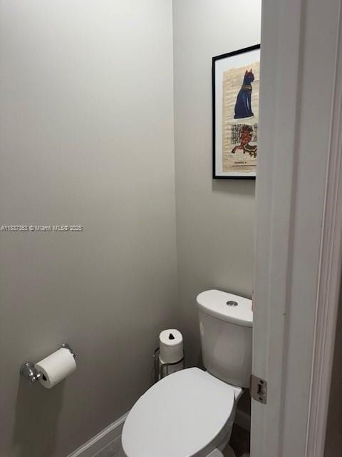 6349 Topsail Dr, West Palm Beach, FL 33413 - bathroom featuring toilet and baseboards