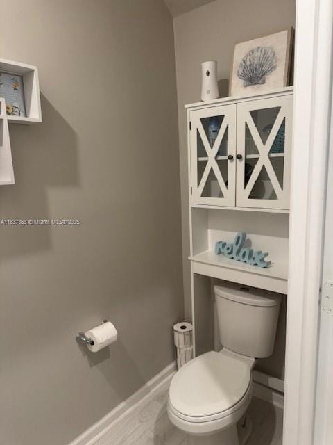 6349 Topsail Dr, West Palm Beach, FL 33413 - bathroom with toilet and baseboards