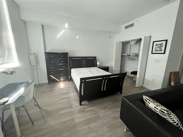 234 NE 3rd St Unit 905, Miami, FL 33132 - bedroom featuring light wood-style flooring and a closet