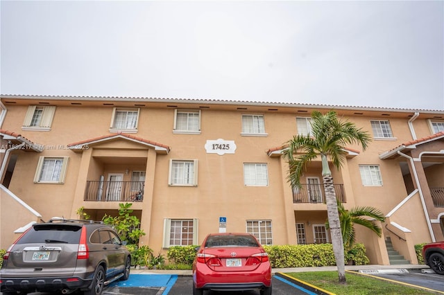 17425 NW 75th Pl Unit 101, Hialeah, FL 33015 - view of apartment building / complex with uncovered parking
