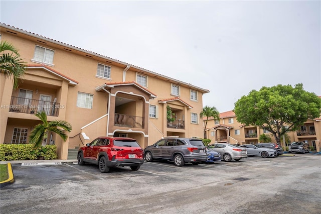 17425 NW 75th Pl Unit 101, Hialeah, FL 33015 - view of property with uncovered parking