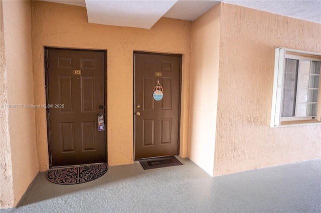 17425 NW 75th Pl Unit 101, Hialeah, FL 33015 - property entrance with stucco siding