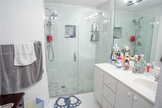 17425 NW 75th Pl Unit 101, Hialeah, FL 33015 - bathroom featuring a marble finish shower, vanity, and tile patterned floors