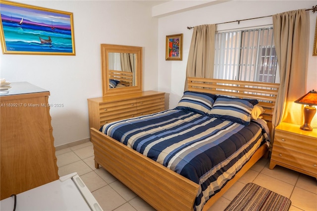 17425 NW 75th Pl Unit 101, Hialeah, FL 33015 - bedroom featuring light tile patterned flooring and baseboards