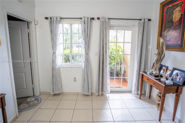 17425 NW 75th Pl Unit 101, Hialeah, FL 33015 - doorway to outside featuring plenty of natural light and tile patterned flooring
