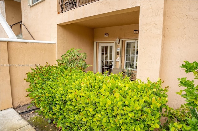 17425 NW 75th Pl Unit 101, Hialeah, FL 33015 - view of exterior entry featuring stucco siding