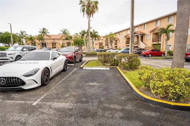 17425 NW 75th Pl Unit 101, Hialeah, FL 33015 - uncovered parking lot with a residential view