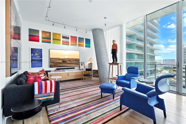 2675 S Bayshore Dr Unit 1601S, Miami, FL 33133 - living area featuring wood finished floors, floor to ceiling windows, and track lighting