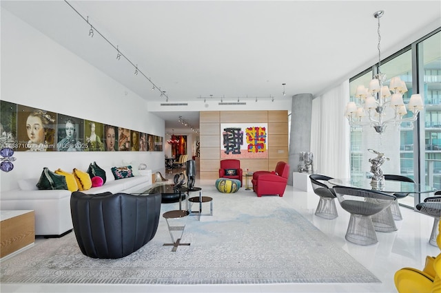 2675 S Bayshore Dr Unit 1601S, Miami, FL 33133 - living room with track lighting, a chandelier, and expansive windows