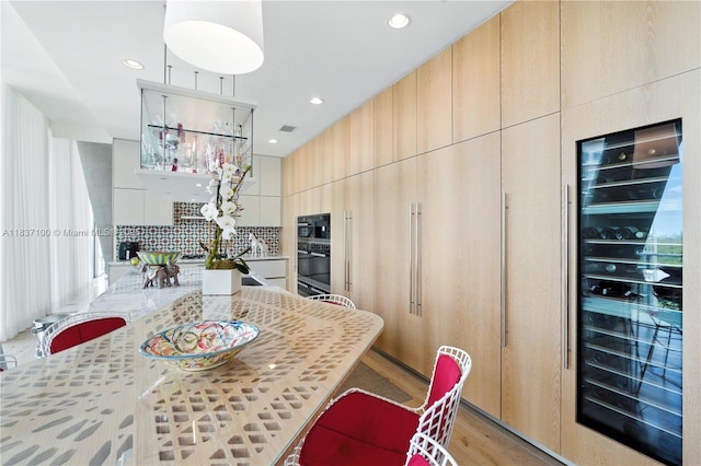2675 S Bayshore Dr Unit 1601S, Miami, FL 33133 - kitchen featuring beverage cooler, modern cabinets, backsplash, recessed lighting, and light wood-type flooring