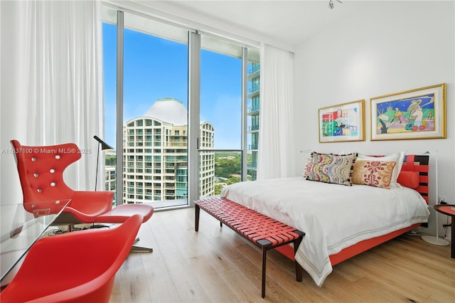2675 S Bayshore Dr Unit 1601S, Miami, FL 33133 - bedroom with floor to ceiling windows, multiple windows, and wood finished floors