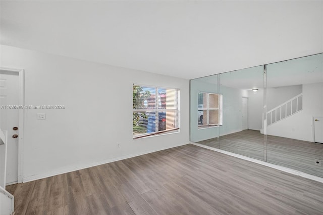 2767 NW 197th Ter, Miami Gardens, FL 33056 - spare room featuring wood finished floors and stairs