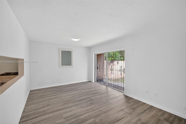 2767 NW 197th Ter, Miami Gardens, FL 33056 - spare room with wood finished floors and baseboards