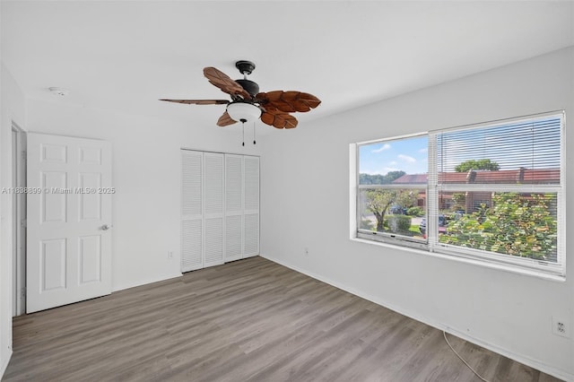 2767 NW 197th Ter, Miami Gardens, FL 33056 - unfurnished bedroom with a closet, wood finished floors, and ceiling fan