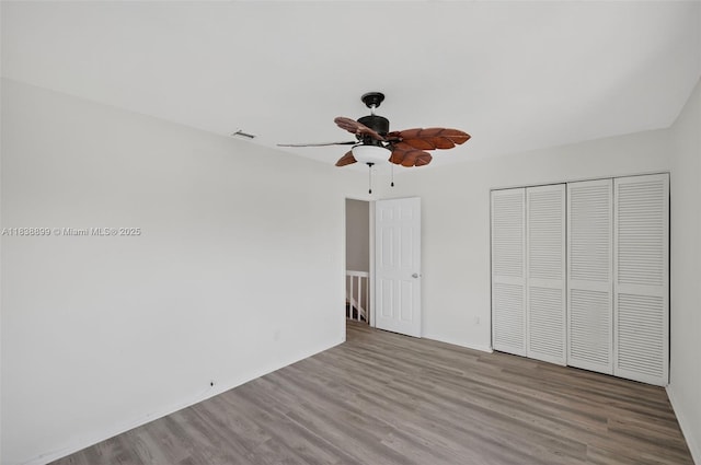 2767 NW 197th Ter, Miami Gardens, FL 33056 - unfurnished bedroom featuring wood finished floors, a closet, and a ceiling fan