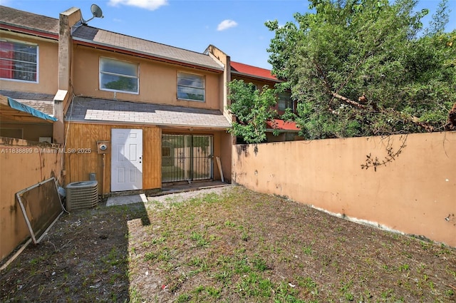 2767 NW 197th Ter, Miami Gardens, FL 33056 - rear view of house with roof with shingles and stucco siding