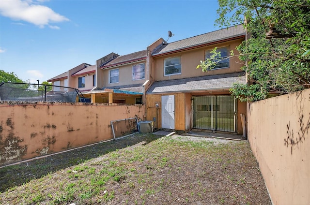 2767 NW 197th Ter, Miami Gardens, FL 33056 - rear view of property with a fenced backyard and stucco siding