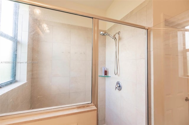 6586 S Anise Ct, Davie, FL 33314 - bathroom featuring a tile shower and plenty of natural light