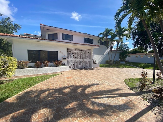 290 NE 108th St, Miami, FL 33161 - back of property featuring stucco siding and a tile roof