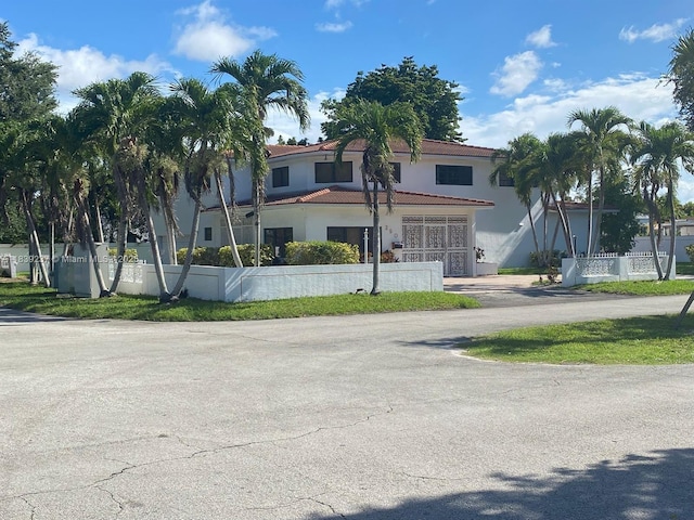 290 NE 108th St, Miami, FL 33161 - view of front facade with stucco siding and a tile roof